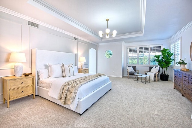 bedroom featuring visible vents, arched walkways, an inviting chandelier, carpet, and a tray ceiling