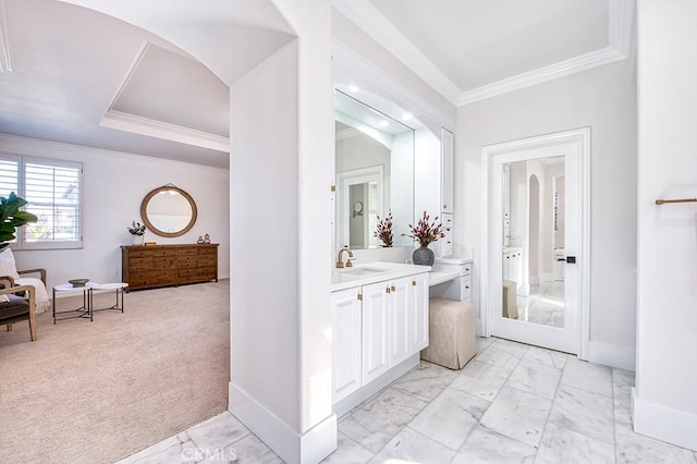 bathroom with marble finish floor, baseboards, and crown molding