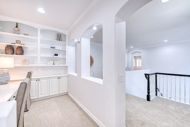 office area with recessed lighting, light carpet, crown molding, and arched walkways