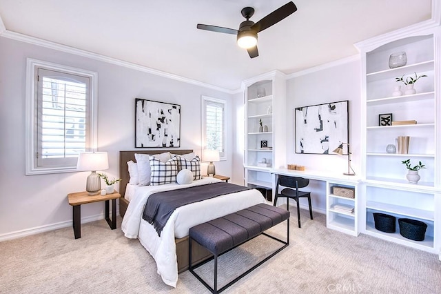 bedroom with a ceiling fan, light carpet, crown molding, and baseboards