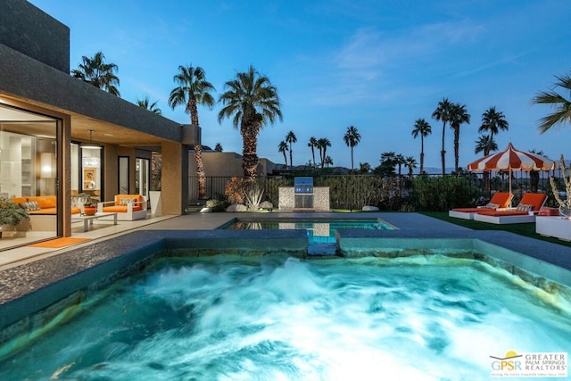 view of swimming pool featuring an in ground hot tub