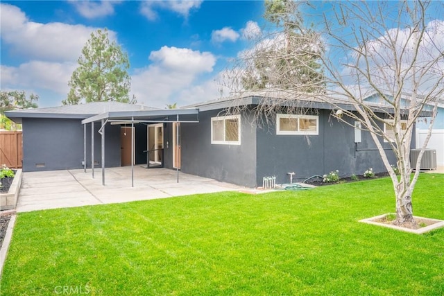 back of house with a yard and central AC unit