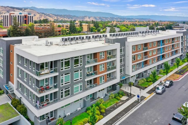 birds eye view of property featuring a mountain view