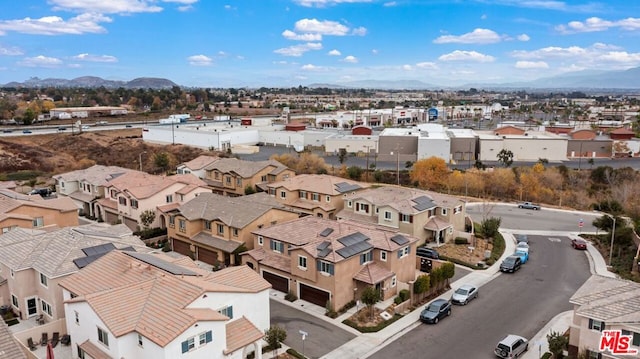 birds eye view of property with a mountain view