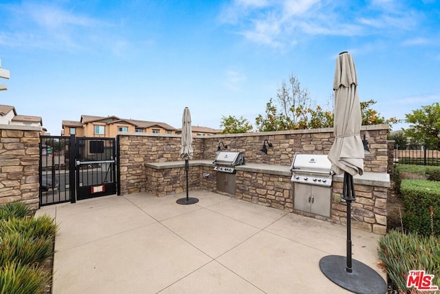 view of patio featuring an outdoor kitchen and area for grilling