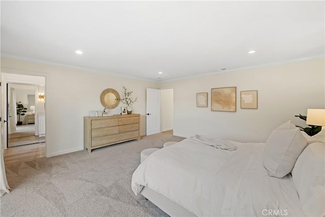 bedroom with light colored carpet and ornamental molding