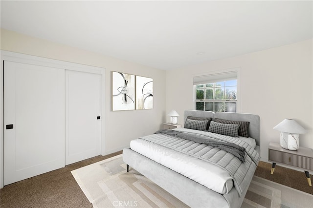 bedroom with carpet floors and a closet