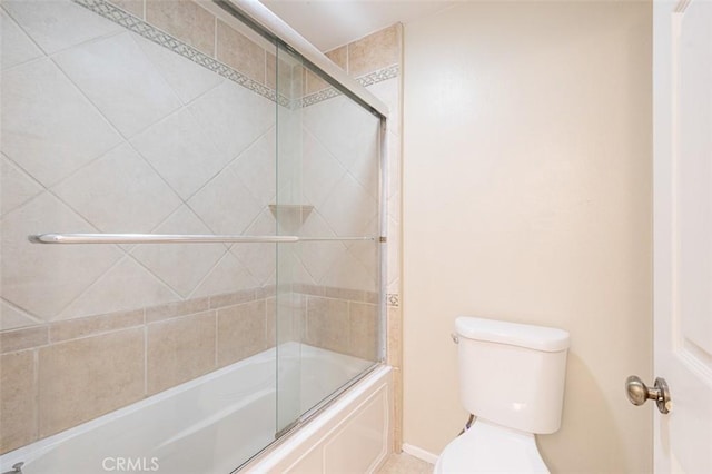 bathroom with toilet and enclosed tub / shower combo