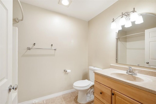 bathroom featuring a shower, toilet, vanity, and tile patterned flooring