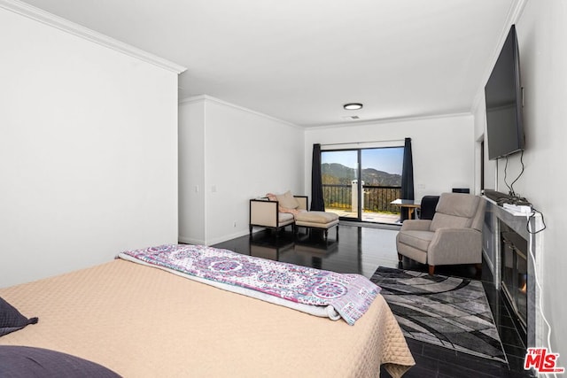 bedroom featuring access to exterior, crown molding, and dark hardwood / wood-style floors