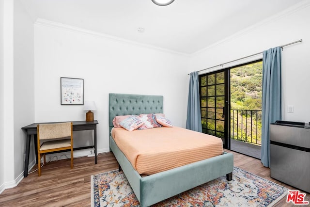 bedroom with access to outside, crown molding, and hardwood / wood-style floors