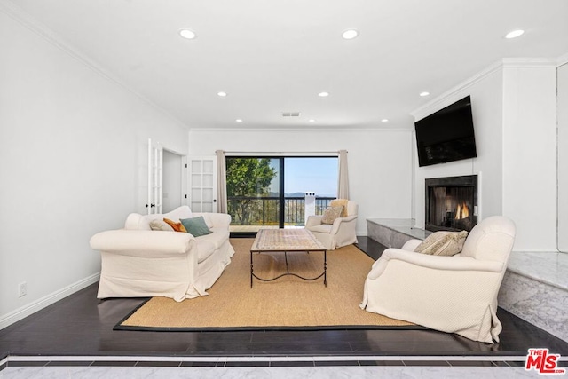 living room featuring crown molding and hardwood / wood-style flooring