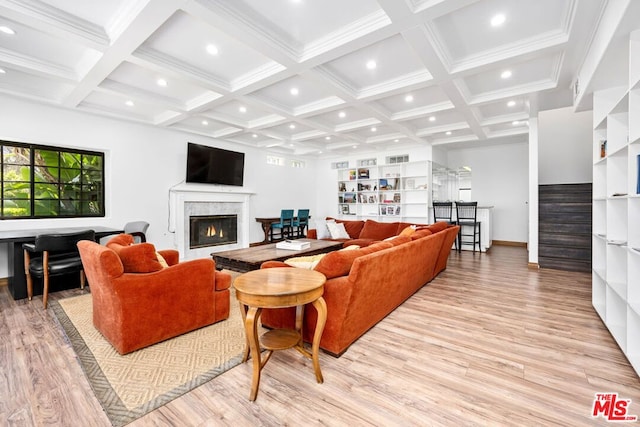 living room featuring beam ceiling, built in shelves, light wood-type flooring, and coffered ceiling