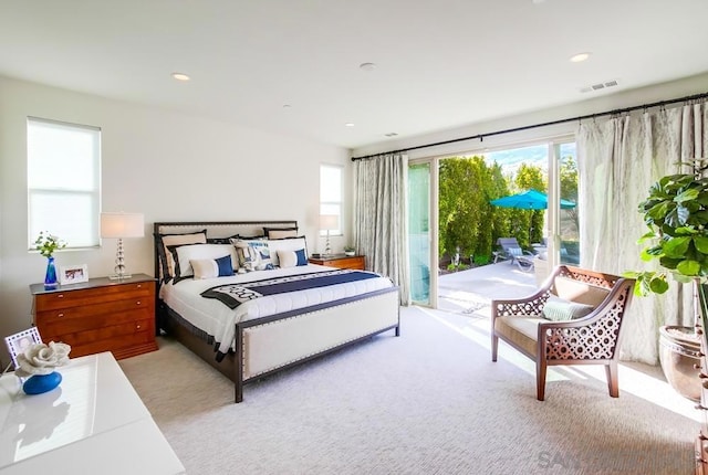 carpeted bedroom featuring access to exterior