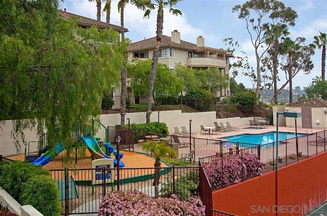 view of swimming pool with a patio area