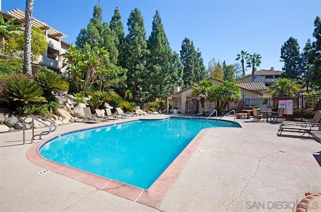 view of swimming pool featuring a patio