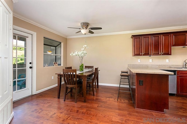 dining area with ceiling fan, dark hardwood / wood-style floors, and crown molding