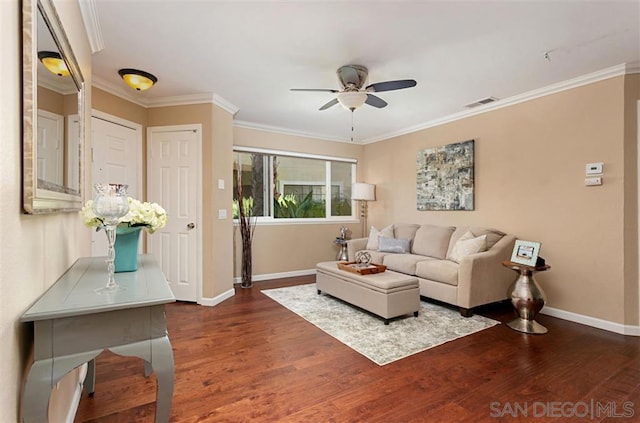 living room with ceiling fan, dark hardwood / wood-style flooring, and ornamental molding