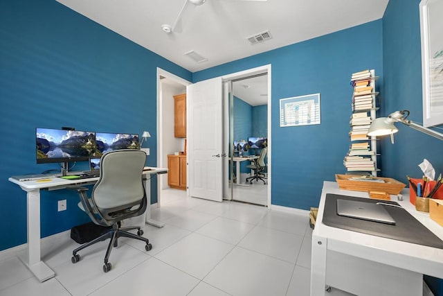 office featuring ceiling fan and light tile patterned floors