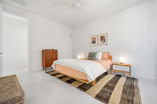 tiled bedroom with ceiling fan