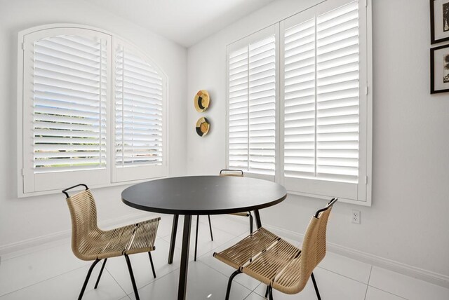 dining area with light tile patterned floors