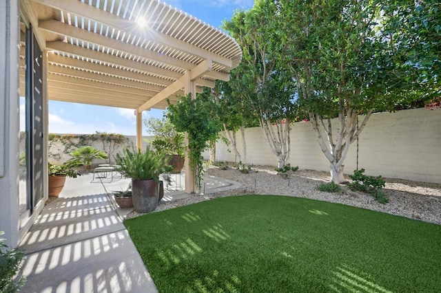 view of yard with a pergola and a patio