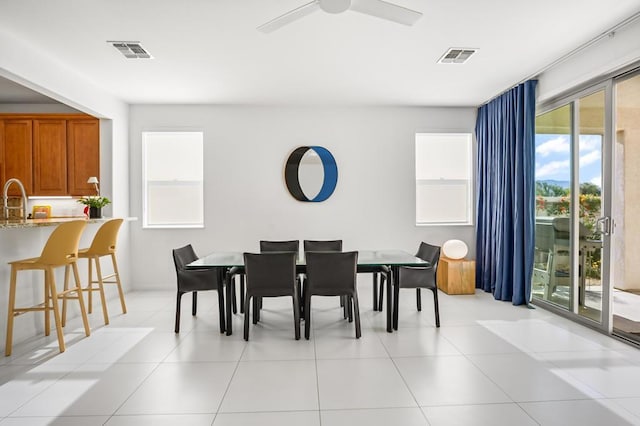 dining area featuring light tile patterned flooring and ceiling fan