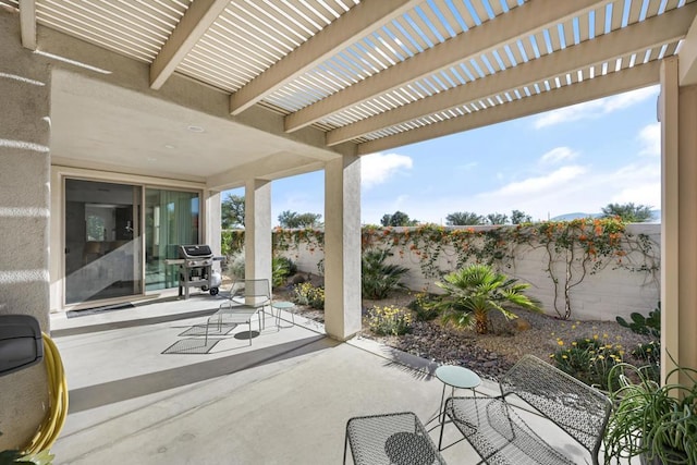 view of patio with a grill and a pergola