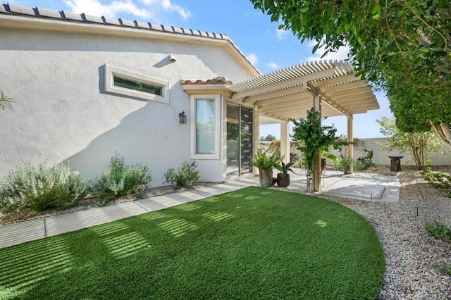 exterior space featuring a lawn, a patio area, and a pergola