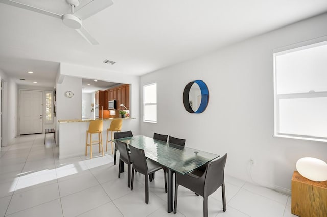 dining area with light tile patterned floors