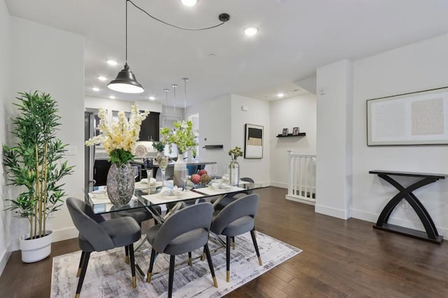 dining area featuring dark hardwood / wood-style floors