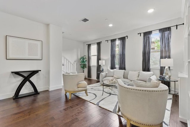 living room featuring dark wood-type flooring