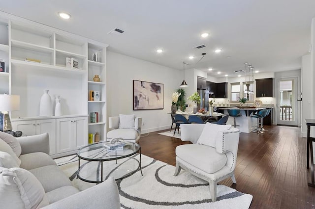 living room featuring dark hardwood / wood-style flooring