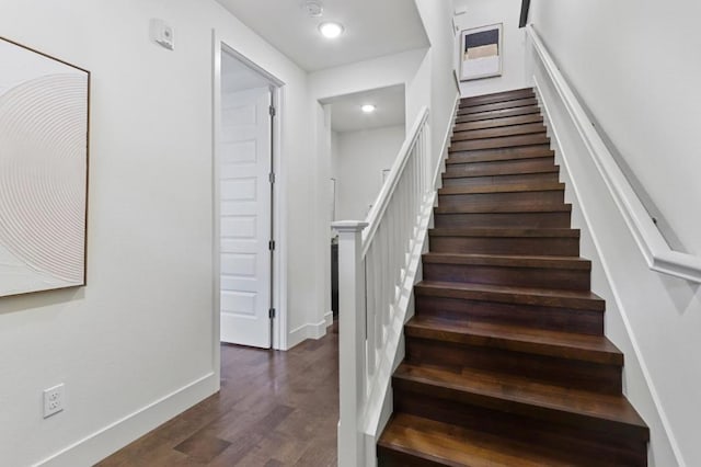 staircase featuring hardwood / wood-style floors