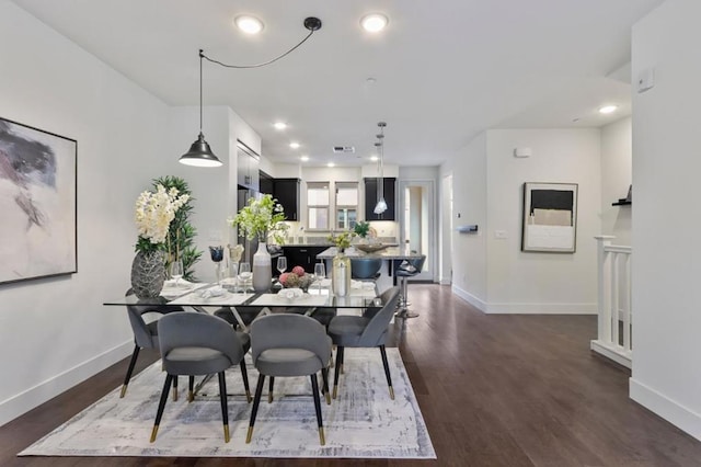 dining space with dark hardwood / wood-style flooring