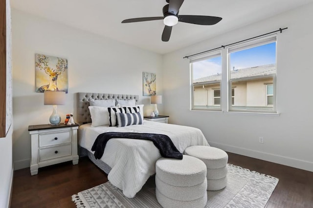 bedroom with ceiling fan and dark wood-type flooring