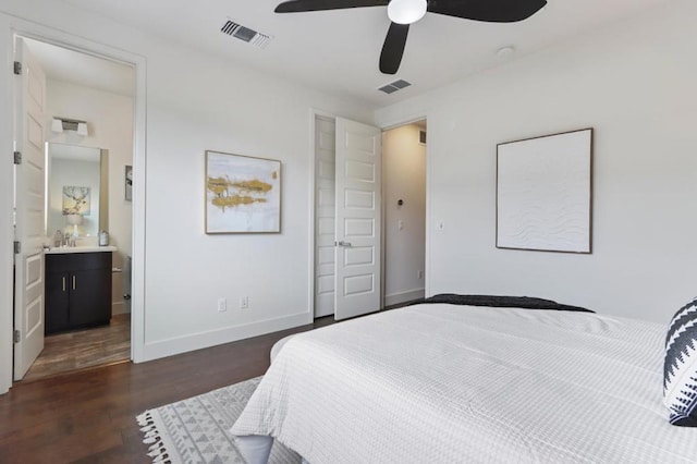 bedroom featuring ceiling fan, dark hardwood / wood-style flooring, connected bathroom, and sink