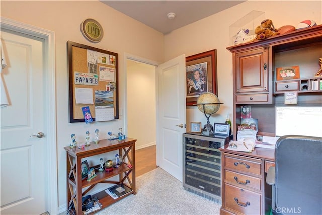 home office with light carpet and wine cooler