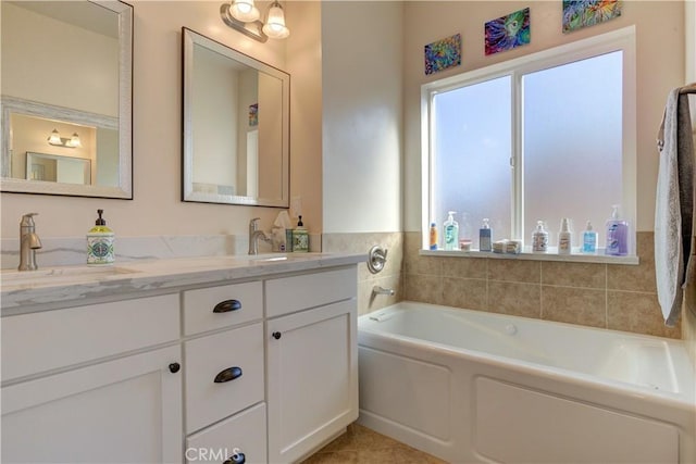 bathroom featuring vanity and a bath