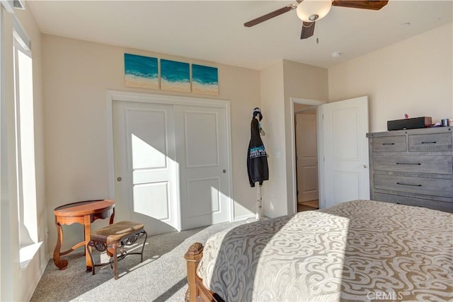 bedroom featuring ceiling fan and light colored carpet