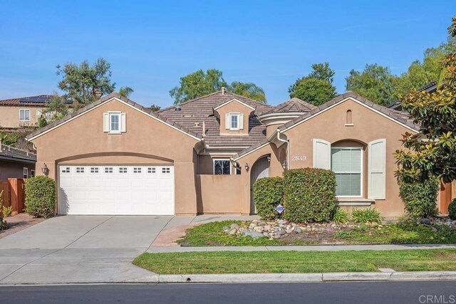 view of front of property featuring a garage