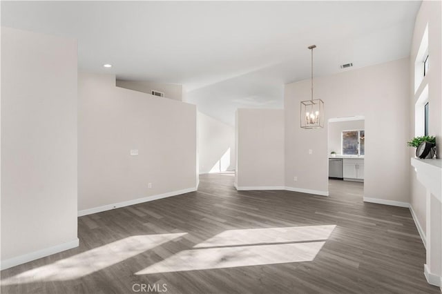 interior space with dark hardwood / wood-style flooring and an inviting chandelier