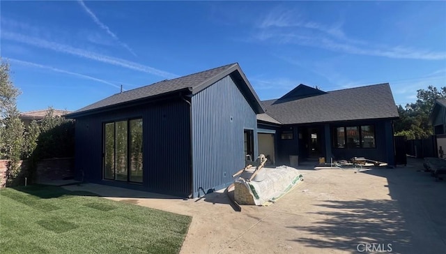 view of front of property with a front lawn and a patio area