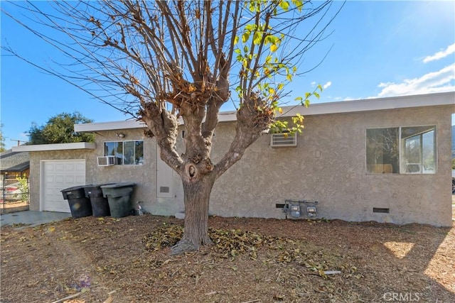 view of side of home with a garage