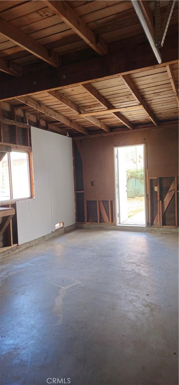 misc room featuring concrete flooring and a healthy amount of sunlight