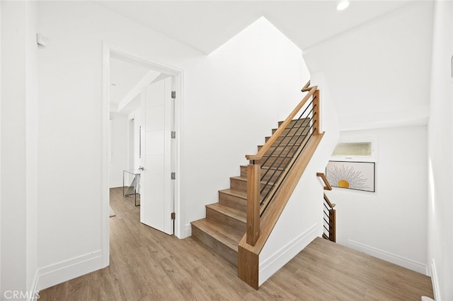 stairway with wood-type flooring