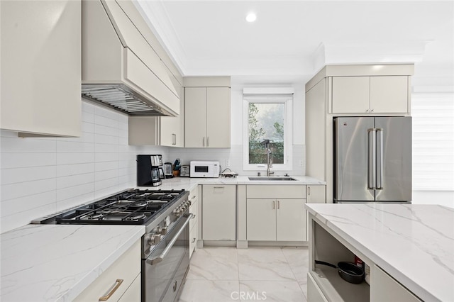 kitchen with decorative backsplash, sink, light stone countertops, premium appliances, and custom range hood