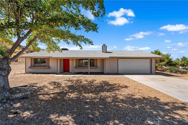 ranch-style home featuring a garage