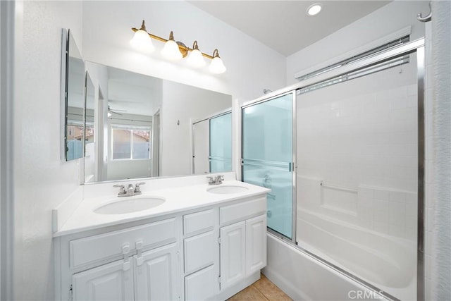 bathroom with ceiling fan, vanity, tile patterned floors, and shower / bath combination with glass door