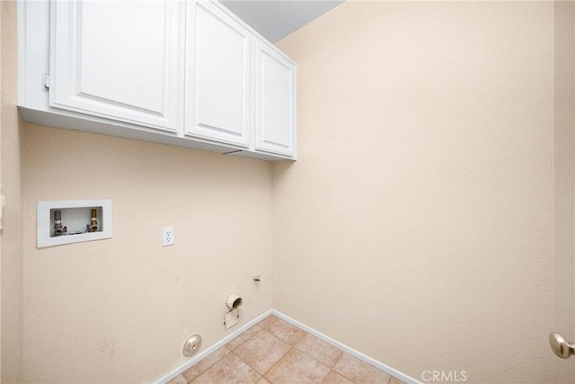 laundry room featuring washer hookup, cabinets, gas dryer hookup, and light tile patterned flooring